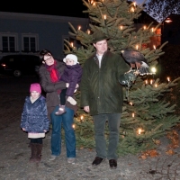 Weihnachtspostkarte: Jagdleiter mit Familie und Wüstenbussard